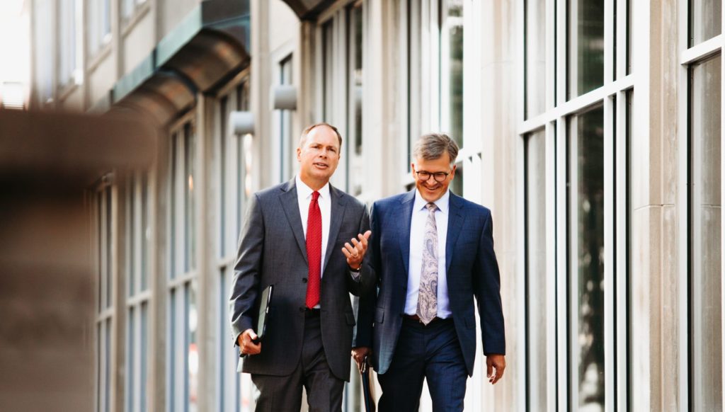 Executives walking outside the Connable Office image